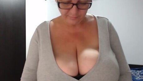 Busty cougar is teasing men with her huge boobs