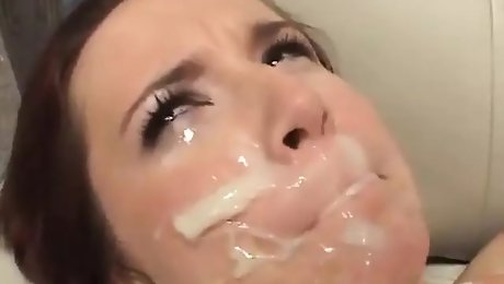 Lusty whore has warm cum running down her face after gang bang